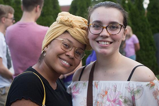 Photo of two female Chatham University students posing together at a multicultural affairs event. 